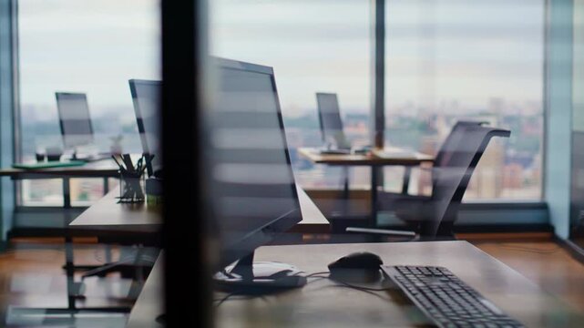 Modern coworking workspace computers wooden desks closeup. Empty bright office
