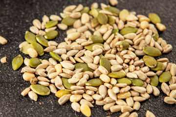 Seed mix sunflower seeds and pumpkin seeds natural product tasty snack fresh delicious gourmet food background on the table rustic top view copy space keto and paleo diet vegan and vegan food