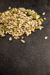 Seed mix sunflower seeds and pumpkin seeds natural product tasty snack fresh delicious gourmet food background on the table rustic top view copy space keto and paleo diet vegan and vegan food