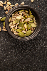 Seed mix sunflower seeds and pumpkin seeds natural product tasty snack fresh delicious gourmet food background on the table rustic top view copy space keto and paleo diet vegan and vegan food