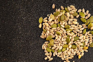 Seed mix sunflower seeds and pumpkin seeds natural product tasty snack fresh delicious gourmet food background on the table rustic top view copy space keto and paleo diet vegan and vegan food