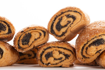 Biscuits with poppy seeds on white background, closeup.