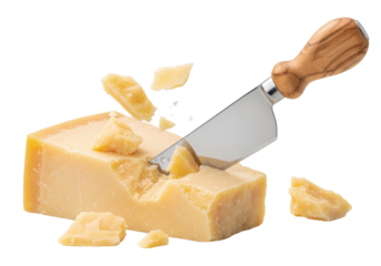 Aged Parmesan cheese wedge with a stainless steel cheese knife pressing into it, creating scattered shards, on a transparent background with copy space, gourmet food concept