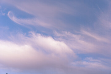 The full moon glowing through a dramatic cloudscape at night, concept of night sky, astronomy, natural beauty