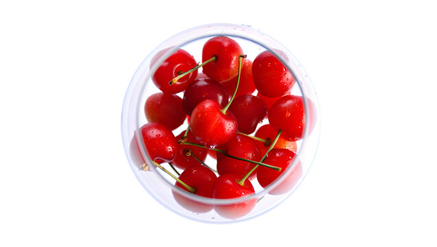 Fresh ripe red grape tomatoes in a clear plastic clamshell container isolated on transparent background