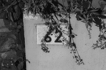 European style house number 62 (sixty two) stone tile in black and white