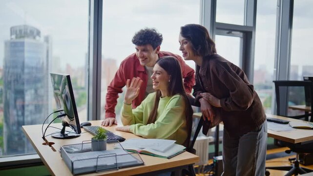 Startupers discussing project online talking to laptop webcam in office closeup