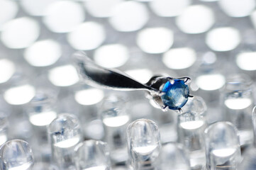 Elegant Silver Ring with Sapphire Gemstone on Sparkling Background