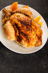 Baked chicken with oranges whole grilled chicken christmas holiday dish new year natural product tasty snack fresh delicious gourmet food background on the table rustic top view copy space
