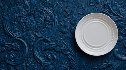 White plate on dark blue ornate background
