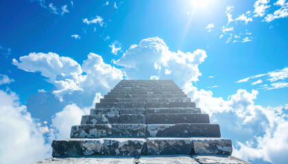 Stone stairs ascending into the sky, fluffy white clouds and bright blue sky. Freedom and dreams