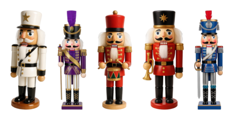 Traditional wooden nutcracker figures set including soldiers, drummer, and king in red, blue, purple, and white uniforms isolated. Festive holiday and Christmas season decoration.