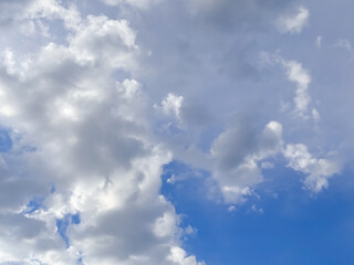 Layered Cumulus and Altocumulus Clouds over Bright Blue Sky