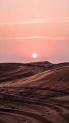 Naklejka premium Golden Desert Dunes under Pink Sunset Sky 