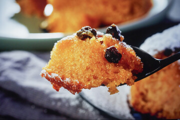 Close-up of a Spoonful of Sponge Cake with Raisins