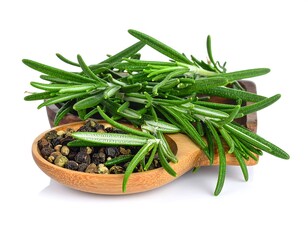 Fresh rosemary sprigs and peppercorns in a wooden spoon