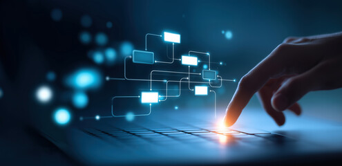 Hand touching a laptop keyboard with glowing digital flowchart icons representing data processing and automation, Concept of artificial intelligence and technology innovation
