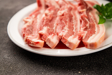 Bacon slice lard with meat slices pieces pork tenderloin portion size natural product tasty snack fresh delicious gourmet food background on the table rustic top view copy space
