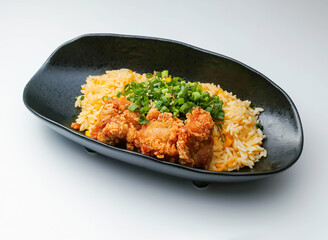 Zangi Fried Rice with Scallions on a Black Dish side view of japanese food