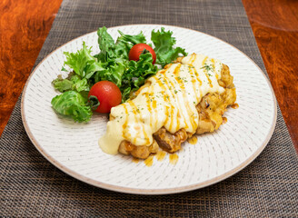 Japanese Chicken Nanban with Tartar Sauce and Sweet Glaze in plate side view of Asian cuisine