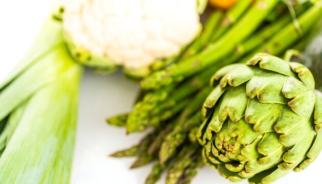 Fresh green vegetables ? artichokes, asparagus, and cauliflower