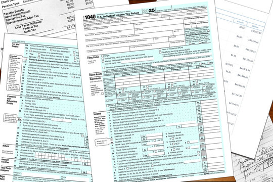 2025 tax year IRS form 1040 and made up financial notes lay on a desktop. 
