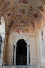 Archbasilica of Saint John Lateran Rome exterior facade and grand baroque interior with golden coffered ceiling vast nave marble statues side chapels ornate altar apse and dome Catholic basilica © Thao