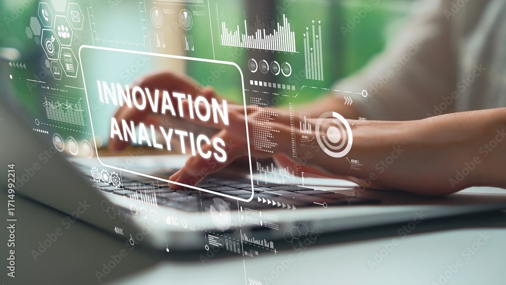Poster hands typing on laptop with overlay of innovation and analytics graphics in modern office environmen