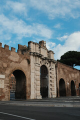 Fototapeta premium Archbasilica of Saint John Lateran facade and Lateran district with piazza palace and Porta San Giovanni ancient walls Rome Italy exterior architecture landmark. High quality photo