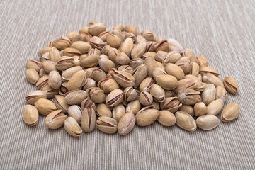 Roasted salted pistachios in shells, traditional snack food.	
