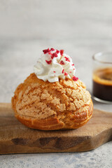 A delightful Cream Puff filled with Whipped Cream and Coffee