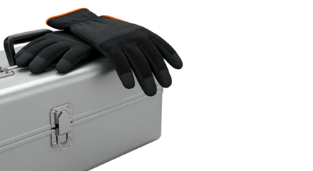 Professional safety gloves lying on a sturdy aluminum tool case, symbolizing preparation for manual labor or a home improvement project