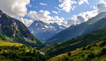 A vast mountain valley unfolds under a vibrant sky, showcasing rugged peaks and lush green slopes.