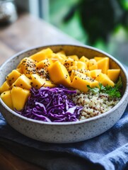 Colorful quinoa bowl with mango, red cabbage, and herbs served in a rustic setting