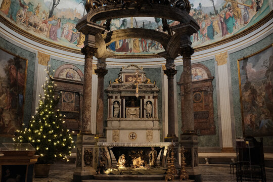 Basilica of the Holy Cross in Jerusalem Rome apse with mosaic baldachin and nativity scene Christmas decorations ornate Catholic church interior editorial use only. High quality photo
