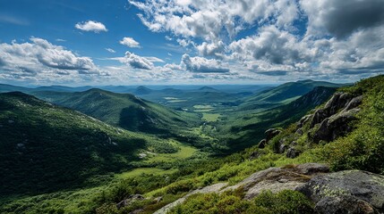 Stunning green valley vista unfolds beneath dramatic clouds, inspiring wanderlust and adventure