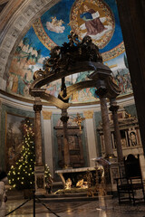 Basilica of the Holy Cross in Jerusalem Rome apse with mosaic baldachin and nativity scene Christmas decorations ornate Catholic church interior editorial use only. High quality photo © Thao