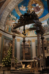 Basilica of the Holy Cross in Jerusalem Rome apse with mosaic baldachin and nativity scene Christmas decorations ornate Catholic church interior editorial use only. High quality photo © Thao
