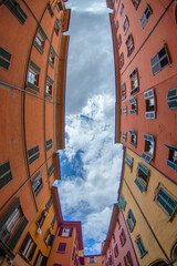 Colorful Fisheye View of Bologna Facades with Dramatic Sky