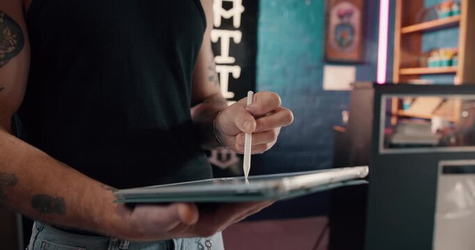 Hands, person and artist with tattoo on tablet for research, drawing sketch and creative process. Man, stylus and review design for artwork, prepare stencil and digital editing for body art in shop