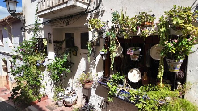 Traditional Spanish house with plants and flowers in Polop Spain