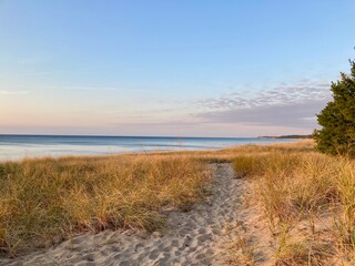 Beach at Lake Michigan with sand dunes and sunset