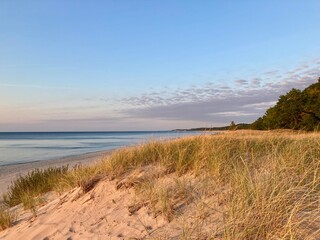 Beach with Sand dunes at Lake Michigan with sunset