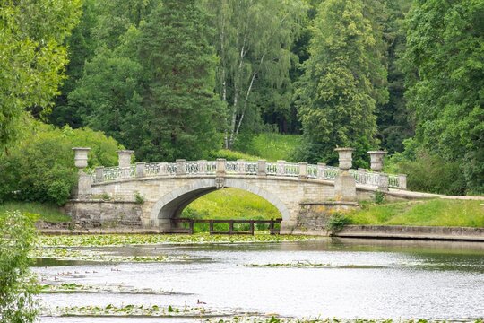 Viskontiyev Bridge across the Slavyanka River in Pavlovsk Park in summer. St. Petersburg. Pavlovsk.