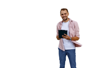 Smiling man standing, holding a tablet, engaging with digital content on transparent background