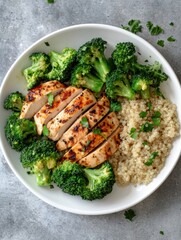 Healthy grilled chicken with broccoli and quinoa in a simple bowl for a nutritious meal at lunch or dinner