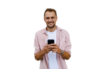 Young man smiling while holding smartphone, texting and interacting with mobile technology, transparent background