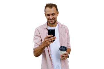 Smiling man holding phone and coffee, connecting online, enjoying social media or mobile communication, transparent background
