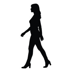 A woman walking with a confident stride a striking black silhouette