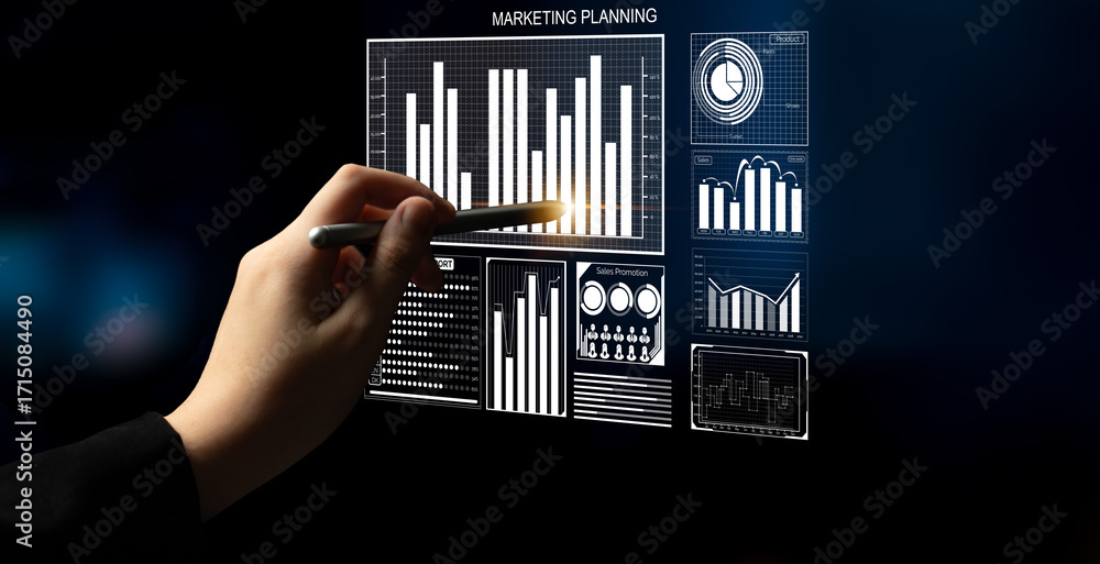 Poster a hand holds a pen while pointing at digital graphs and charts on a screen, illustrating marketing p